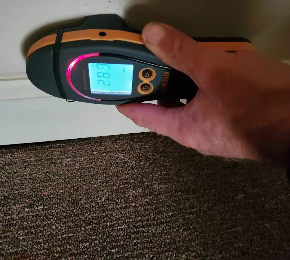 Moisture detection at baseboard during Storm Damage Restoration in Crestwood